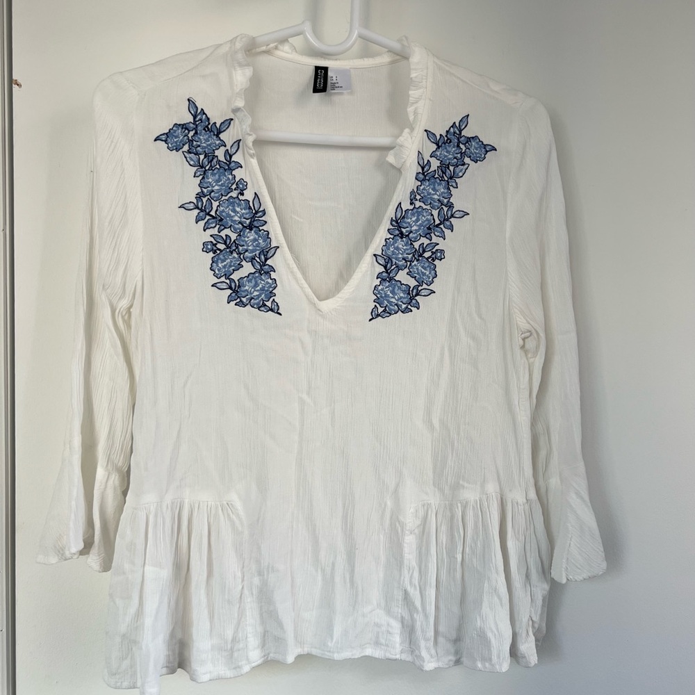 H&M flowy white top with blue floral designs